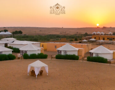 Aerial view of Suryaansh luxury camp in Jaisalmer surrounded by the golden Thar Desert.