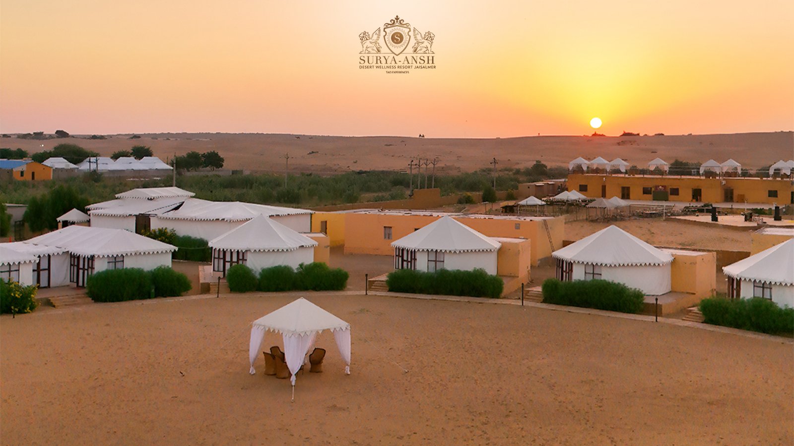 Aerial view of Suryaansh luxury camp in Jaisalmer surrounded by the golden Thar Desert.